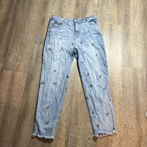 Tinseltown blue jeans with snakes on them